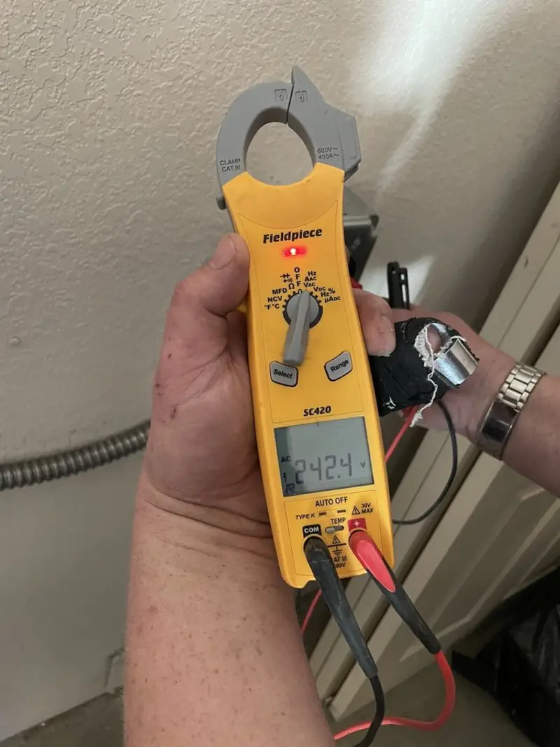 Voltage testing with clamp meter during Recessed Lighting Installation in Nanticoke